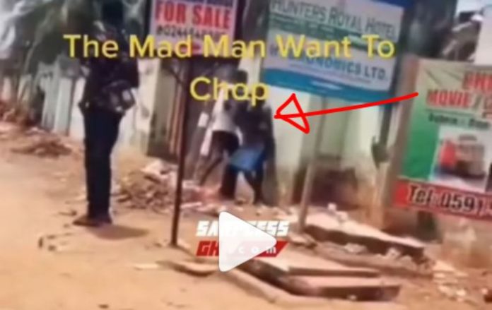 (+18 Video) Mad Man Tries To CHOP A Lady In Public After Chewing Viagra He Found On The Ground