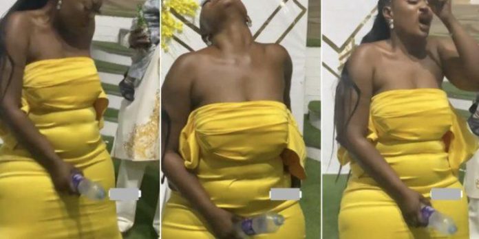 Slay Queen Captured Using Bottle On Her TONGA At A Wedding Party (VIDEO)