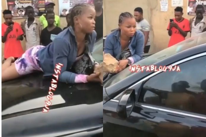 Prostitute Threatens To Smash A Man’s Car Glasses With Stone After Eating Her All Night Without Payment (Video)