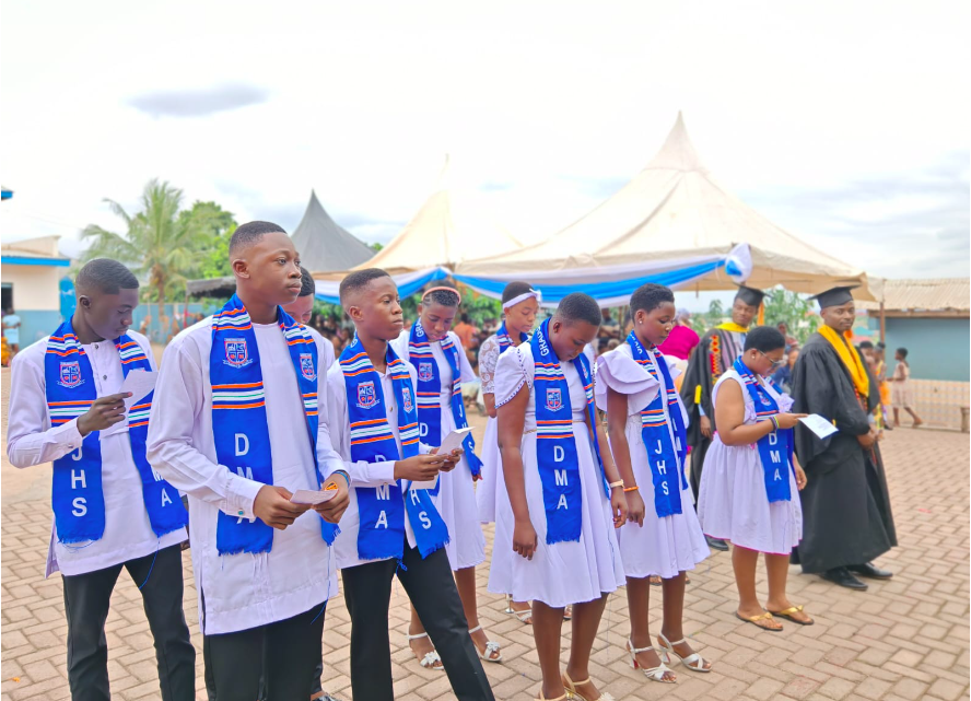 Graduating JHS students of Divine Mission Academy beaming with pride.